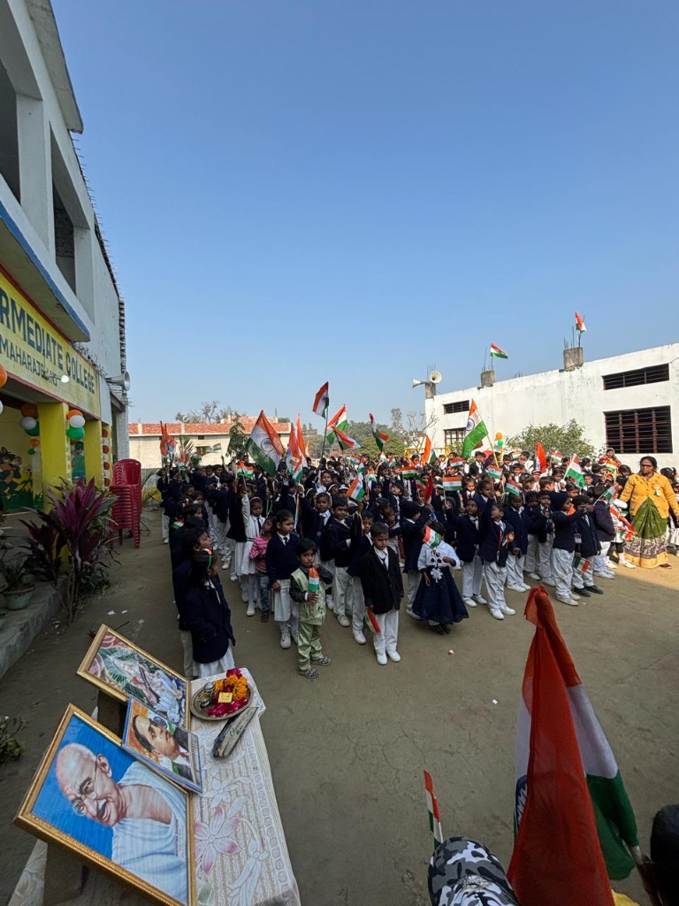 Courtyard parade assembly with Gandhi and Ambedkar portraits